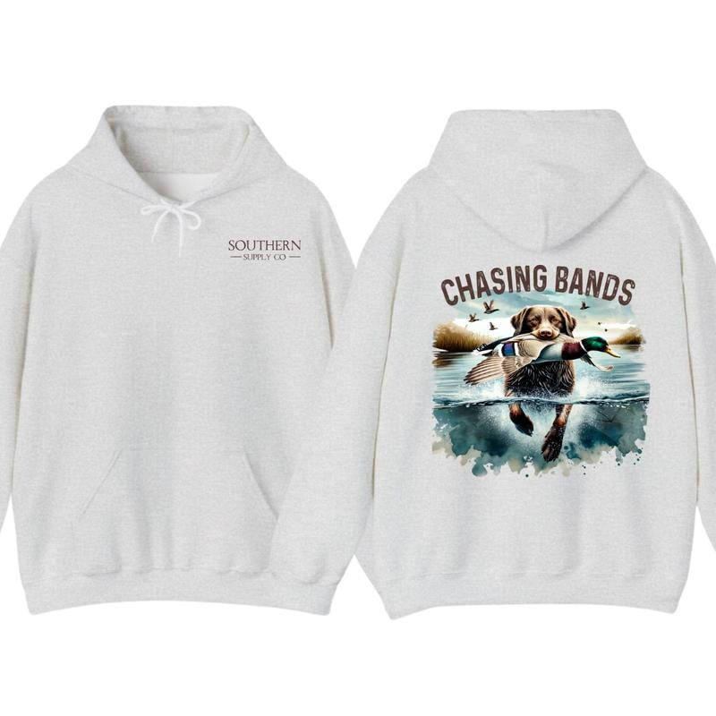 Chasing Bands Duck Hunting Hoodie - Chocolate Lab Retriever with Mallard Duck Waterfowl Graphic for Outdoor Enthusiasts, Unisex
