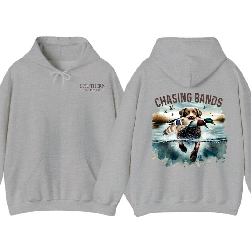 Chasing Bands Duck Hunting Hoodie - Chocolate Lab Retriever with Mallard Duck Waterfowl Graphic for Outdoor Enthusiasts, Unisex