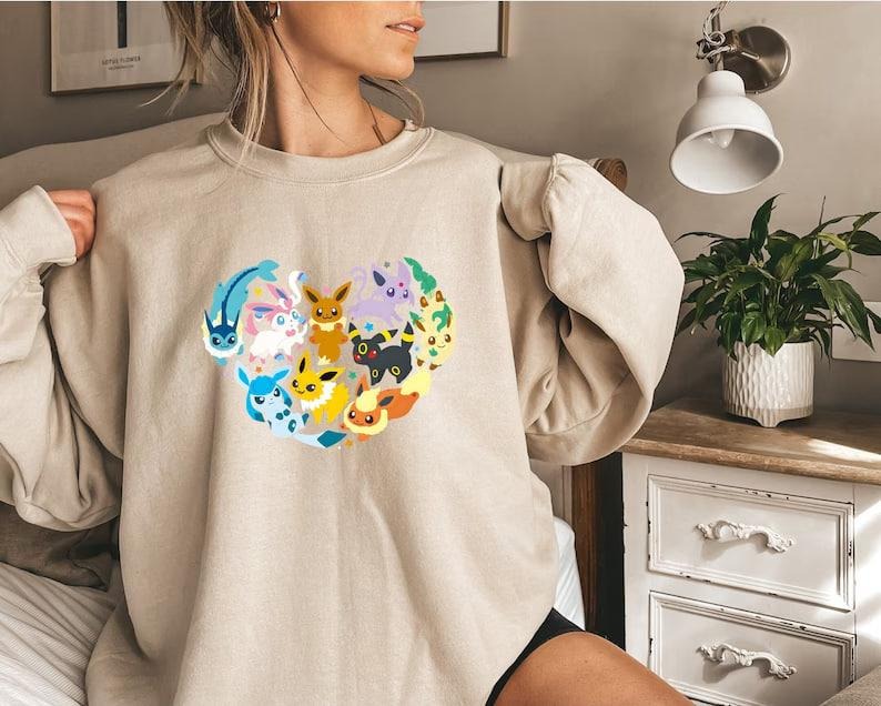 Eevee Eeveelution Sweatshirt, Slyveon, umbreon, Espeon, Flareon Anime, Vintage Anime Sweater, Anime lover gift, Anime merch, Anime Lover Sweatshirt, Hoodie Gift, Gift for anime fan, Sweater, Anime Gift, Kawaii