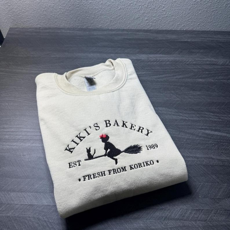 Embroidered KiKi's Bakery Unisex Crewneck Sweatshirt, Jiji Shirt, Kiki's Delivery Service, Studio Ghibli Sweatshirt, Hayao Miyazaki Shirt