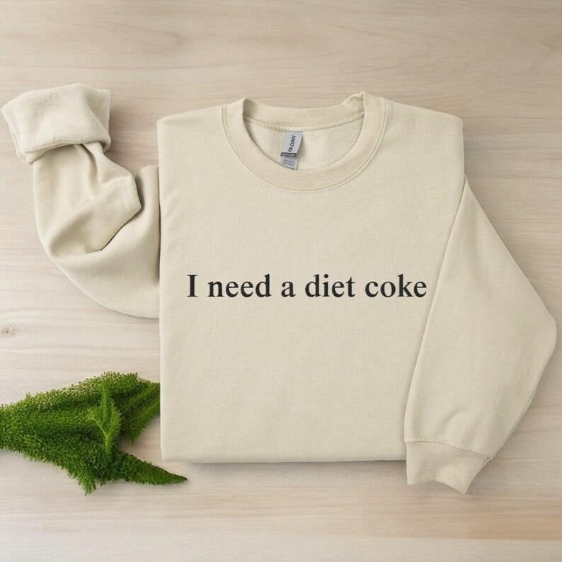 [Sale Up To 60%] I Need a Diet Coke Sweatshirt T-Shirt, Trendy Sweatshirt, Cute Sweatshirt, Gift for Her, For Women, Unisex Shirt